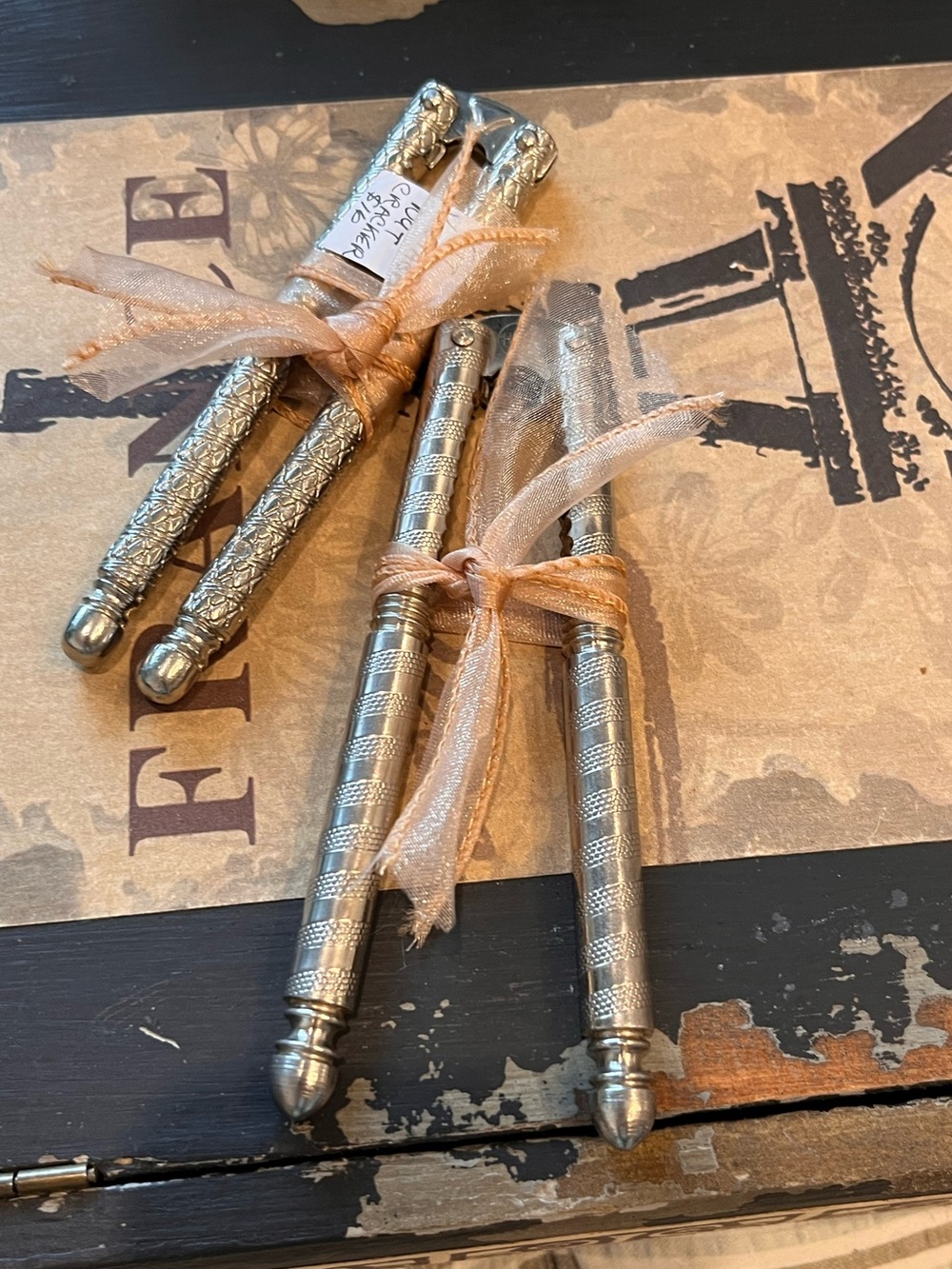 Vintage nut crackers in silver tone metal with ornate detail. 2 available.